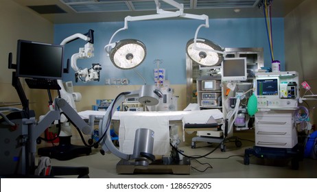 Hybrid modern operating theater room, OR, with medical equipment and devices at the hospital. ventilator, Lights, Computers ready for cardiovascular surgery. - Shutterstock ID 1286529205