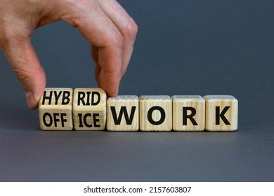 Hybrid Or Office Work Symbol. Businessman Turns Cubes And Changes Words 'office Work' To 'hybrid Work'. Beautiful Grey Background. Business, Hybrid Or Office Working Concept, Copy Space.