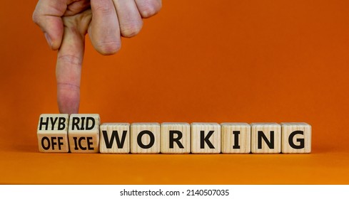 Hybrid Or Office Working Symbol. Businessman Turns Cubes And Changes Words 'office Working' To 'hybrid Working'. Beautiful Orange Background. Business, Hybrid Or Office Working Concept, Copy Space.