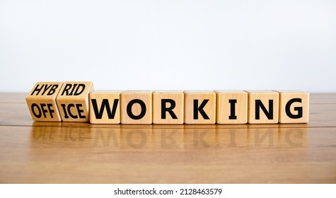 Hybrid Or Office Working Symbol. Turned Wooden Cubes And Changed Words Office Working To Hybrid Working. Beautiful White Background. Business Hybrid Or Office Working Concept, Copy Space.