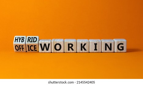 Hybrid Or Office Working Symbol. Turned Wooden Cubes And Changed Words 'office Working' To 'hybrid Working'. Beautiful Orange Background. Business, Hybrid Or Office Working Concept, Copy Space.