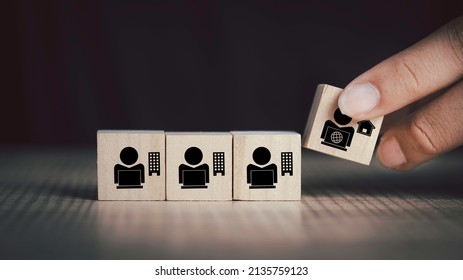 Hybrid workplace schedule, Gig economy, Freelance, Online business network communication, teamwork, home office concept. Hand hold wooden cube  icon of gig economy, copy space for background or text.