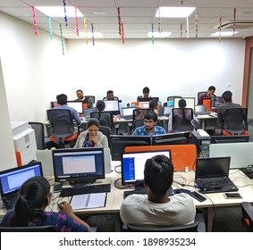 Hyderabad, India - January 21, 2021: Multiracial Young Creative People In Modern Office. Group Of Young Businesspeople Is Working Together With Laptop, Tablet, Smartphone, Notebook. 