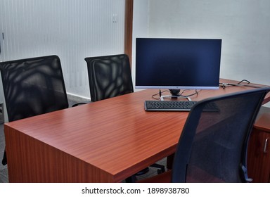 Hyderabad, India - January 21, 2021: Stylish Workspace With Desktop Computer, Office Supplies, Houseplant And Books At Office. Desk Work Concept