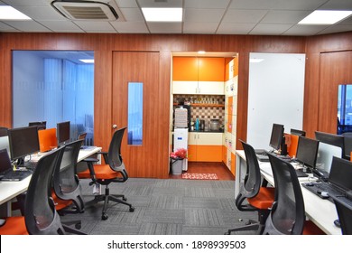 Hyderabad, India - January 21, 2021: Employees Work In Office Buildings Cooperate Company With Orange Furniture