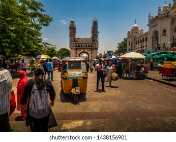 Hyderabad, India - June 17, 2019 : Rickshaw at Charminar, symbol of hyderabad, iconic monument and mosque in India visited by tourists