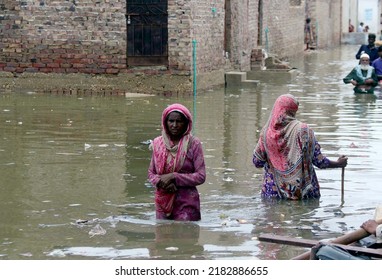 HYDERABAD, PAKISTAN - JUL 26: Destruction due to stagnant rainwater causing of poor sewerage system creating problem for commuters and residents after flood flowed in area on July 26 2022 in Hyderabad
