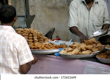 HYDERABAD,AP,INDIA-JANUARY 20:Indian Vendor Sell Street Food In A Busy Market Place On January 20,2014 In Hyderabad,Ap,India.