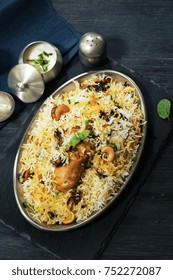 Hyderabadi Chicken Dum Biryani Served With Yogurt Dip, Top View