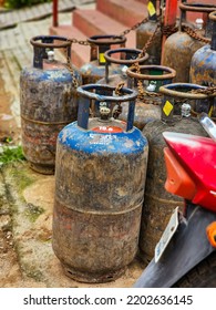 Hyderabad,India- August 6th 2022; Bunch Of Old Rusty LPG Gas Cylinders For Kitchen Cooking Kept Outside Of The Gas Station Or Store For Filling Gas.Picture Captured Under Natural Light.focus On Object