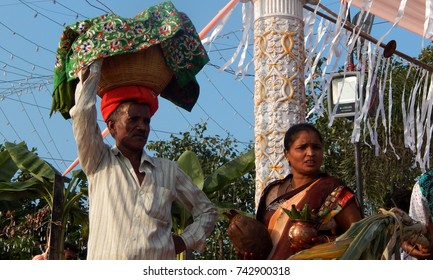 HYDERABAD<INDIA_OCTOBER 26:Hindu devotee brings prasad and other items to offer prayers,on Hussain sagar lake bank,at dusk,to sun God,in Chhath Puja on October 26,2017 in Hyderabad                     