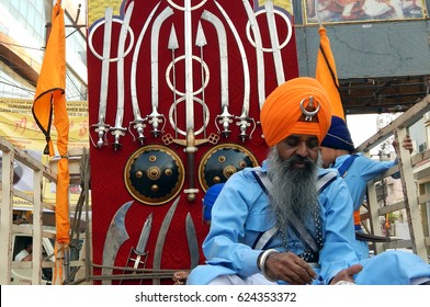 HYDERABAD,INDIA-APRIL 13: sikh man wait with Weapons on truck to demonstrate form of combat Gatka in Nagar kirtan on Vaisakhi  festival on April 13,2017 in Hyderabad                                  