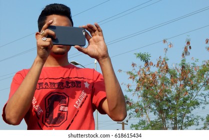 HYDERABAD,INDIA-APRIL 9:Man Taking A Video Of People Play Various Games On Physical Literacy Sundays On Streets With No Traffic On April 9,2017 In Hyderabad                                   