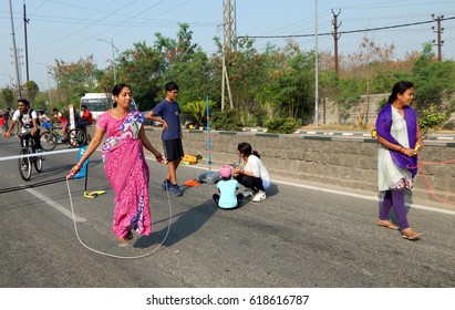 HYDERABAD,INDIA-APRIL 9:Woman Play Skipping Rope Game As Part Of Exercise On Physical Literacy Sundays On Streets With No Traffic On April 9,2017 In Hyderabad                                   