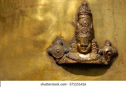 HYDERABAD,INDIA-FEBRUARY 3:  Close up of metal work of Hindu god Balaji or Venkateswara on dwaja stambam of a temple on February 3,2017 in Hyderabad,India                                 