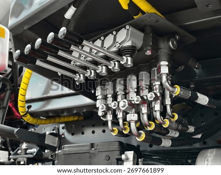 Hydraulic control system showcasing precision engineering in a heavy-duty vehicle in a workshop