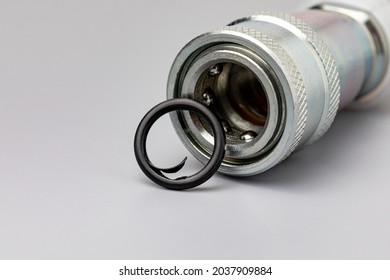 Hydraulic coupler with O-ring seal damage. lawn and farming equipment maintenance, repair and service concept - Shutterstock ID 2037909884