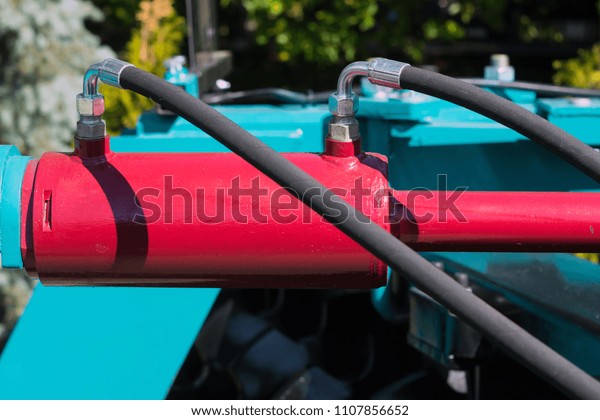 hydraulic cylinder, disk agricultural unit on one\
of the racks