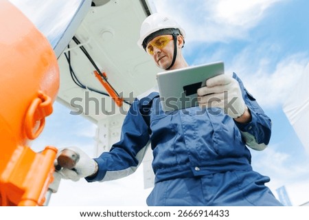 Hydraulic engineer control with computer on new installation hoses pneumatic piston of industrial machine of mining. Concept industry work of mine.
