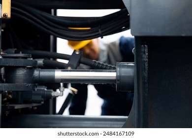 Hydraulic engineer doing safety check on new installation hoses of modern drilling industrial machine - Powered by Shutterstock