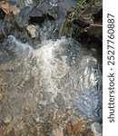 hydraulic jumps create froth in the water flow 