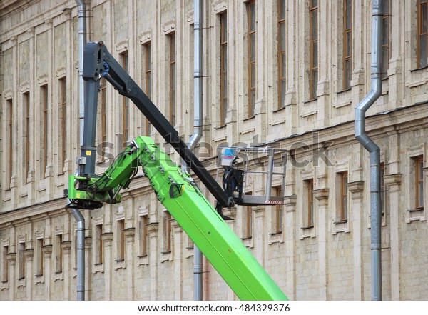 hydraulic lift heavy equipment machine that works\
near the palace.