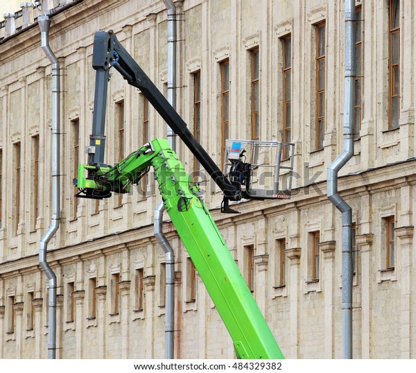 hydraulic lift heavy equipment machine that works\
near the palace.