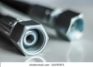 Hydraulic Metal Hose Ends On White Background. Closeup Macro Detail