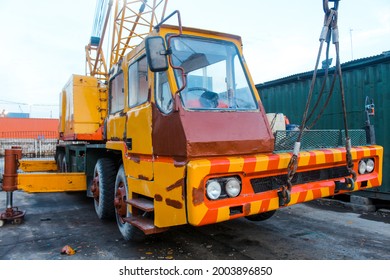 A Hydraulic Mobile Suspended Boat Lift Or Hoist With A Sling, Yellow Crain Rises To The Blue Sky, In The Cargo Port, 