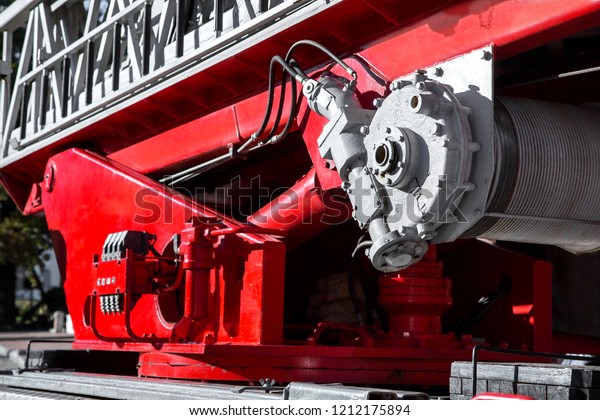 hydraulic system fire engine ladder close up red\
fire car.
