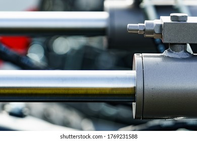 Hydraulic system on modern heavy machine. Industrial detail piston in machinery. Technology.
