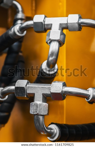 hydraulic system of the tractor, tube and\
connections. focus on the hydraulic\
pipes