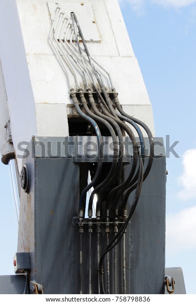 hydraulic system to working excavator on a\
blue sky background.