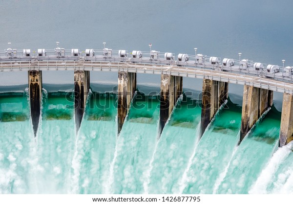 Hydro Electric Dam\
Spilling Water Open Gates