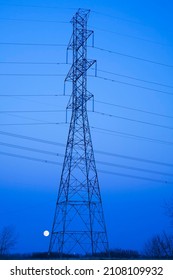 Hydro Electricity Transmission Tower At Dusk, Moonrise, Quebec, Canada