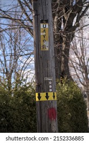 Hydro Quebec Electric Pole, With Some Arrows And Stuff, Took In The Street.