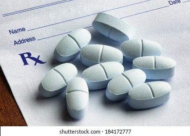 Hydrocodone acetaminophen tablets lying on a prescription form. Hydrocodone is said to be one of the most common recreational prescription drugs in America.