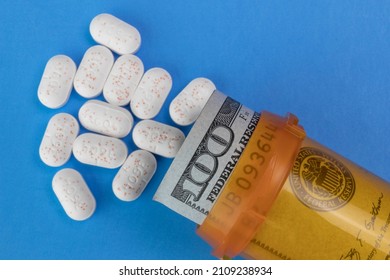 Hydrocodone Tablets With A Hundred Dollar Bill And A Pill Bottle. Opiate Addiction Costs The U.S. Economy $78.5 Billion Per Year.