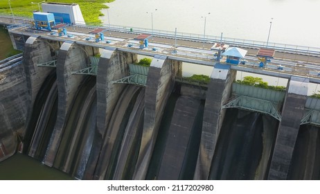 Hydroelectric Dam With Flowing Water Through Gate, Aerial View From Drone. Bendungan Sampean Baru In Java, Indonesia