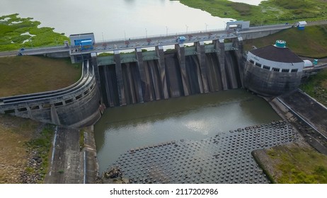 Hydroelectric Dam With Flowing Water Through Gate, Aerial View From Drone. Bendungan Sampean Baru In Java, Indonesia