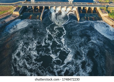 Hydroelectric Dam Or Hydro Power Station At Water Reservoir, Aerial View From Drone. Draining Water Through Gate, Hydropower.