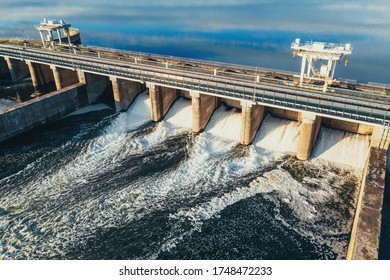 Hydroelectric Dam Or Hydro Power Station At Water Reservoir, Aerial View From Drone. Draining Water Through Gate, Hydropower.