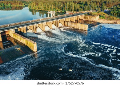 Hydroelectric Dam Or Hydro Power Station At Water Reservoir, Aerial View From Drone. Draining Water Through Gate, Hydropower.