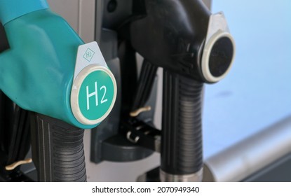 Hydrogen logo on gas stations fuel dispenser. Concept for emission free eco friendly transportation. Green energy. Fuel filler nozzle to fill hydrogen powered vehicles - Shutterstock ID 2070949340