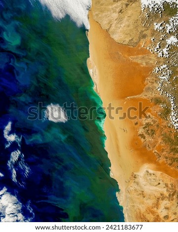 Hydrogen Sulfide Emissions off of Africa. Bright green hues span roughly 150 kilometers along the Namibian coast, the result of gaseous. Elements of this image furnished by NASA.
