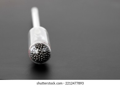 hydrometer, a tool for measuring the density of the battery electrolyte, on a black background