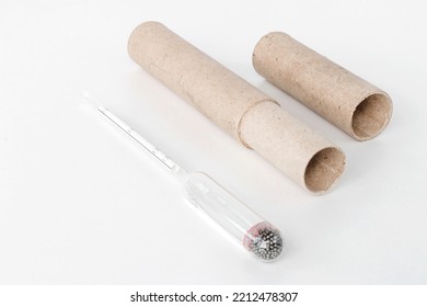 hydrometer, a tool for measuring the density of the battery electrolyte, on a white background