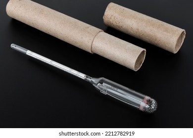 hydrometer, a tool for measuring the density of the battery electrolyte, on a black background