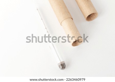 hydrometer, a tool for measuring the density of the battery electrolyte, on a white background