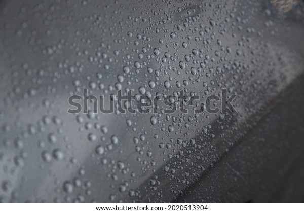 Hydrophobic effect and water drops on car varnish\
after using ceramic\
coating